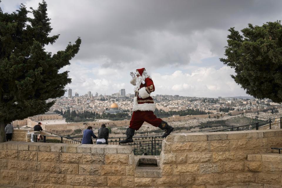 Santa Claus at Mount of Olives overlooking Jerusalem's Old City on Dec. 6, 2022.