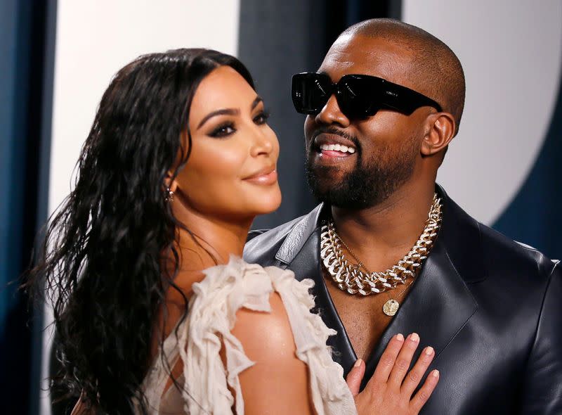 Kim Kardashian and Kanye West attend the Vanity Fair Oscar party in Beverly Hills during the 92nd Academy Awards, in Los Angeles