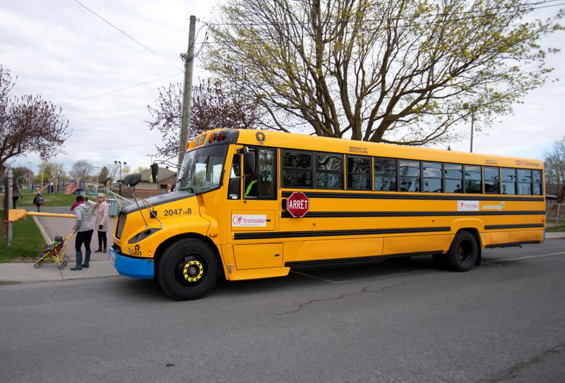 A school bus arrives as schools reopen outside the greater Montreal region in Saint-Jean-sur-Richelieu