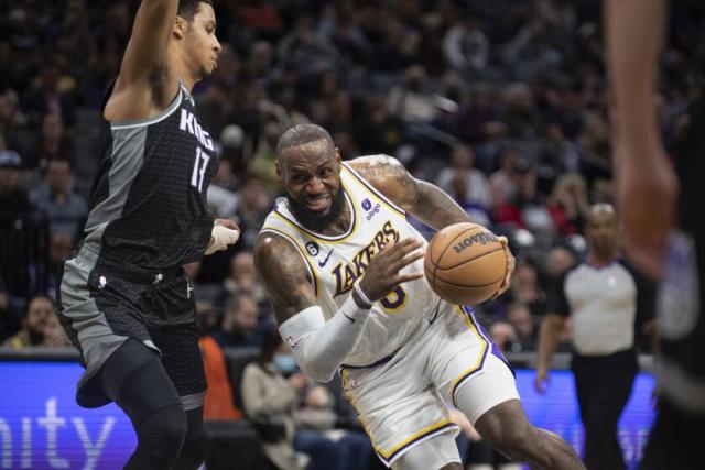 The Lakers' LeBron James drives against the Sacramento Kings' Keegan Murray during the second half Jan. 7, 2023.