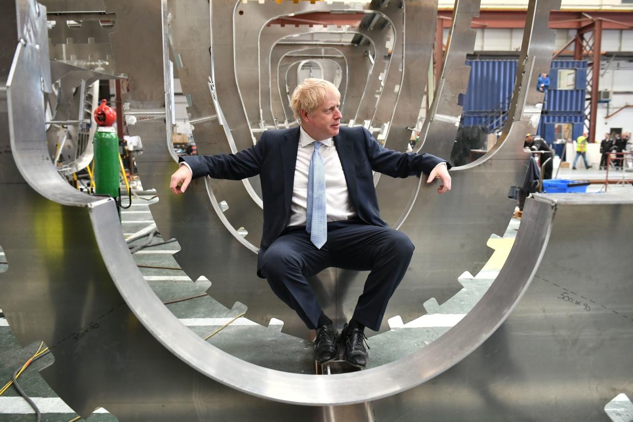 <p>Boris Johnson sits in a boat under construction at the Venture Quay boatyard during a visit to the Isle of Wight on June 27, 2019 </p> (Getty Images)
