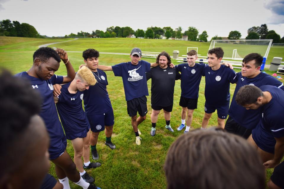 New Sussex County CC men's soccer coach Christian Castro-Pereira, 22, and assistant coach Dylan Fogerty, 24, are seen with their players during their practice at their soccer field in Newton, Sunday on 09/05/22.