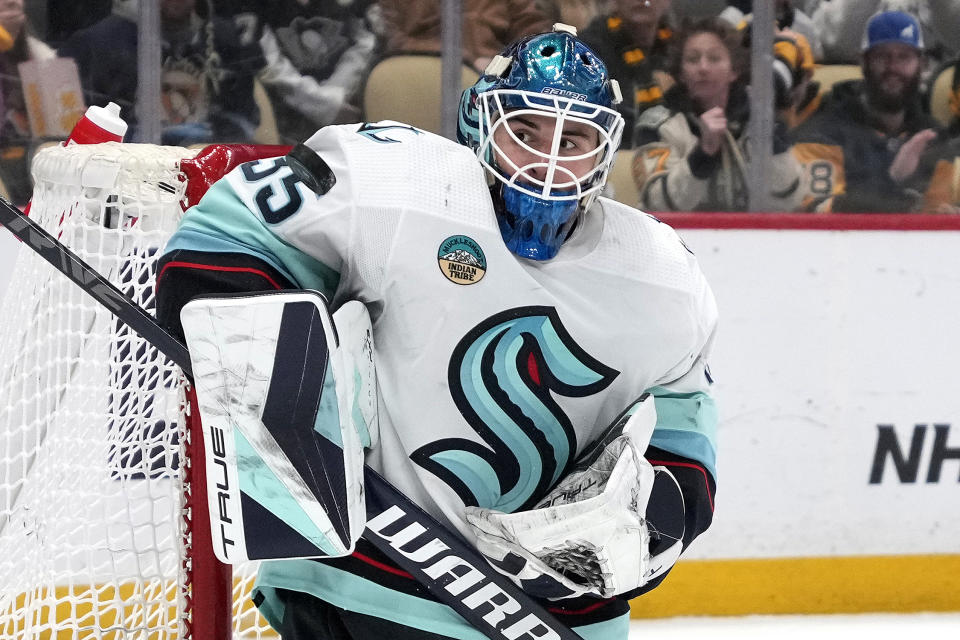 Seattle Kraken goaltender Joey Daccord (35) blocks a shot during the second period of an NHL hockey game against the Pittsburgh Penguins in Pittsburgh, Monday, Jan. 15, 2024. (AP Photo/Gene J. Puskar)