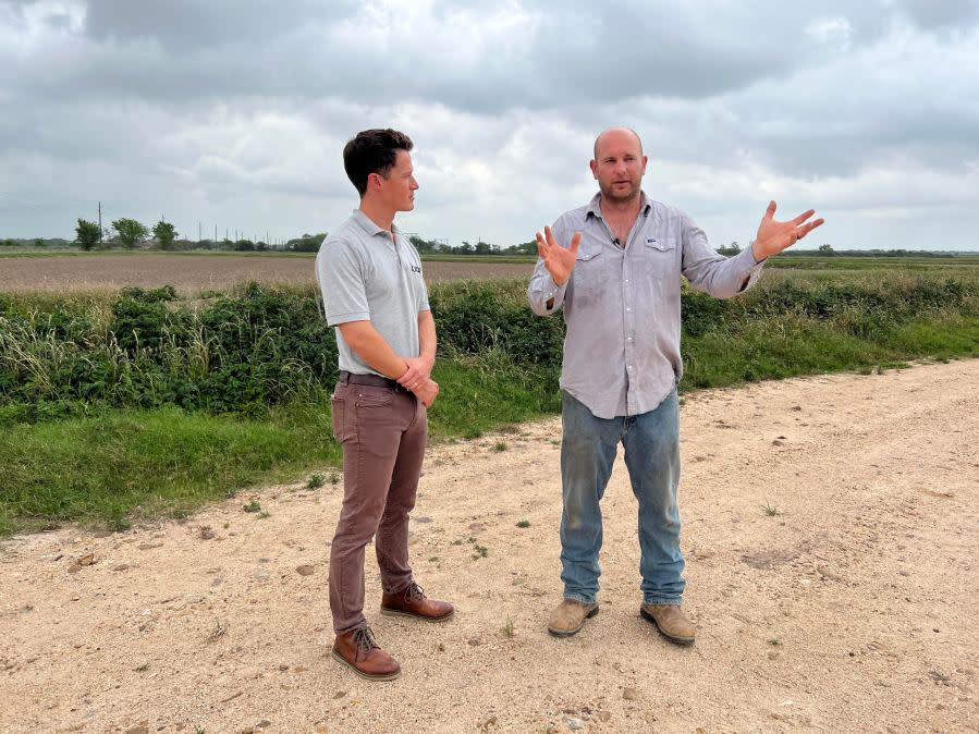 KXAN Chief Meteorologist David Yeomans speaking with rice farmer Tim Gertson near Eagle Lake (KXAN Photo/Chris Nelson)
