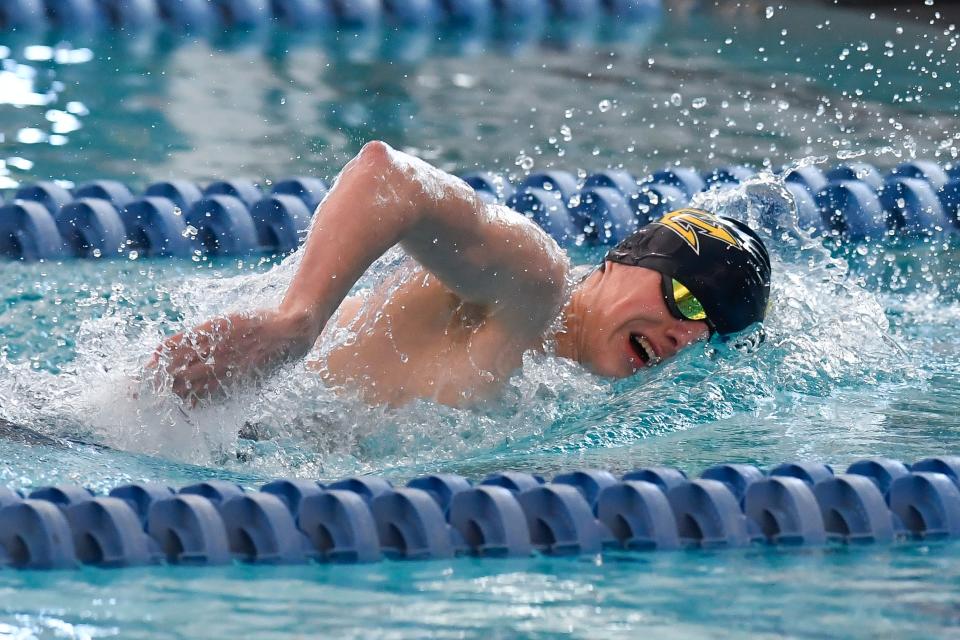 Victor&#39;s Alex Crossing swims in a preliminary heat of the 500 yard freestyle during the 2022 NYSPHSAA Boys Swimming &amp; Diving Championships in Ithaca, N.Y., Friday, March 4, 2022.