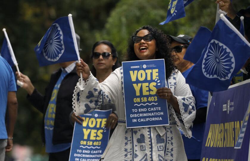 Sacramento, California-Sept. 26, 2023-Thenmozhi Soundararajan, center, of Equality Labs, leads a group pushing for a law to ban caste discrimination, SB 403, rally in front of the Capitol Annex building. They are calling for the passage of SB 403, which Governor Newsom has yet to sign. (Carolyn Cole/Los Angeles Times)