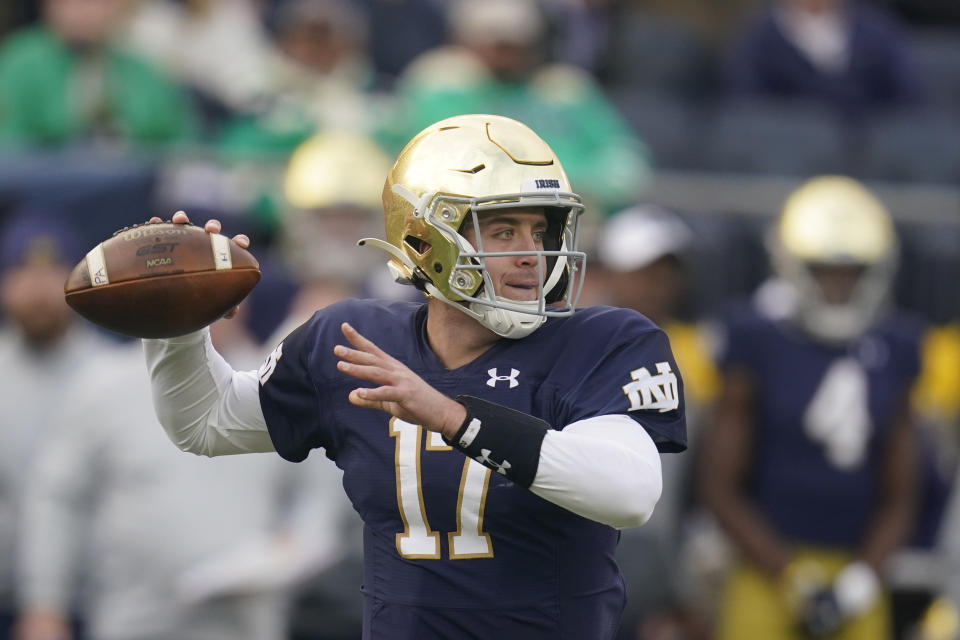 FILE - Notre Dame quarterback Jack Coan (17) throws during the first half of an NCAA college football game against Georgia Tech, Saturday, Nov. 20, 2021, in South Bend, Ind. Coan finally got a chance to don the Irish blue and gold in his final college season. He gets a chance to cap his season in a major way at the New Year's Day Fiesta Bowl. (AP Photo/Darron Cummings, File)