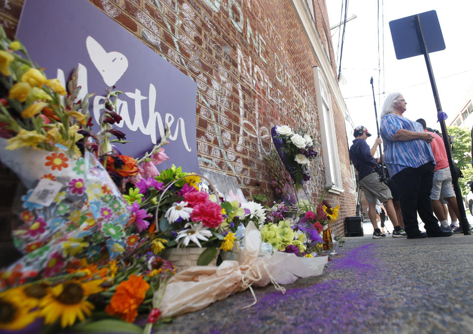 Susan Bro, mother of Heather Heyer who was killed during last year's Unite the Right rally, speaks with reporters at the spot where her daughter was killed in Charlottesville, Va., Friday, Aug. 10, 2018. The governor has declared a state of emergency in anticipation of the anniversary of the rally. (AP Photo/Steve Helber)nam