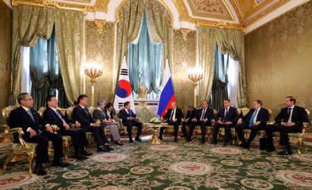 Russian President Vladimir Putin meets with South Korean President Moon Jae-in at the Kremlin in Moscow, Russia June 22, 2018. REUTERS/Sergei Karpukhin