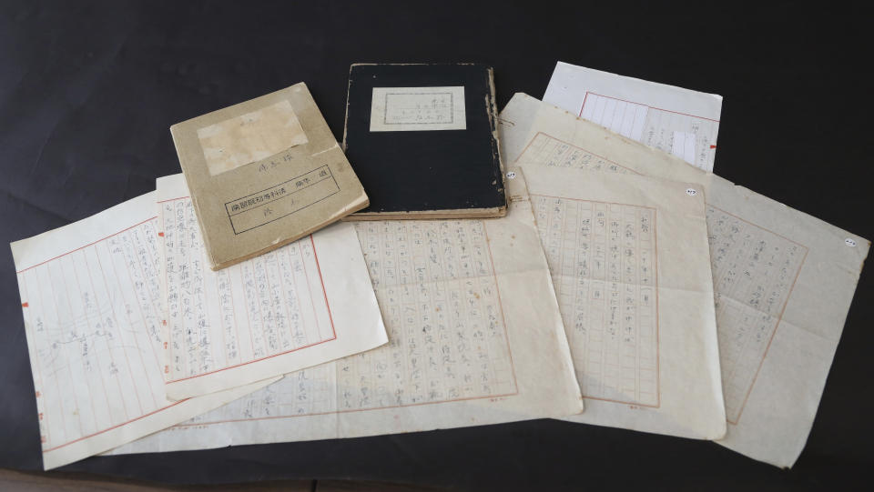 This Dec. 17, 2018, photo shows recently released wartime diaries and notes of schoolteacher Koichi Suzuki, who taught Japan's Emperor Akihito and his classmates during their evacuation outside of Tokyo in the last two years of the World War II. In the documents kept by bookstore owner Takeo Hatano, Akihito's life is removed from his parents amid food shortages and frequent air raid sirens. (AP Photo/Koji Sasahara)