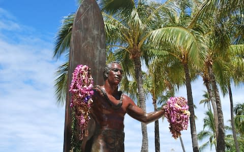 A bronze statue of Duke Kahanamoku welcomes you to Waikiki with open arms - Credit: iStock