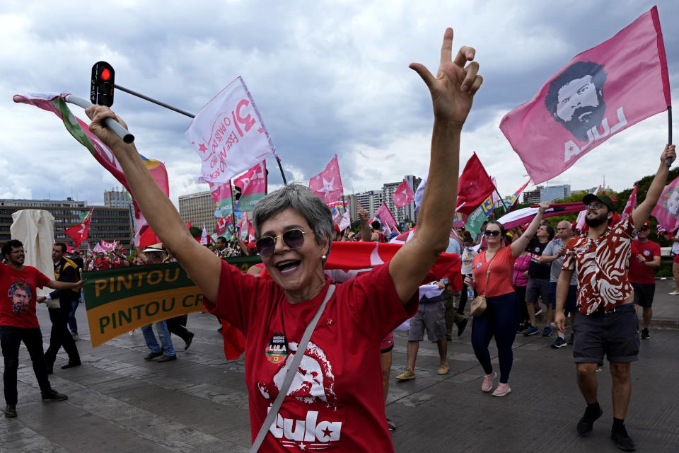 Supporters of Brazil's former President Luiz Inacio Lula da Silva take part in a campaign event in Brasilia, Brazil, Saturday, Oct. 29, 2022. On Sunday, Brazilians head to the voting booth again to choose between da Silva and incumbent Jair Bolsonaro who are facing each other in a runoff vote after neither got enough support to win outright in the Oct. 2 general election. (AP Photo/Eraldo Peres)