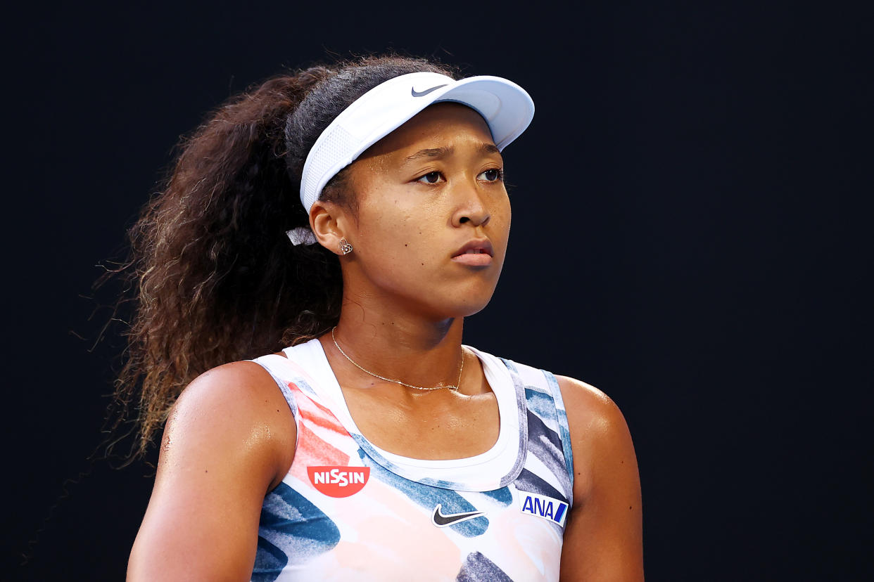 MELBOURNE, AUSTRALIA - JANUARY 24: Naomi Osaka of Japan looks on during her Women's Singles third round match against Coco Gauff of the United States on day five of the 2020 Australian Open at Melbourne Park on January 24, 2020 in Melbourne, Australia. (Photo by Cameron Spencer/Getty Images)