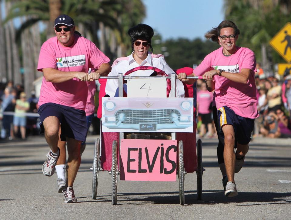 From left, Patrick McFadden, Julie Mastro and Lucas McFadden race down Venice Avenue in the bed races at the 42th Annual Venice Sun Fiesta in 2014. The event returns this weekend.