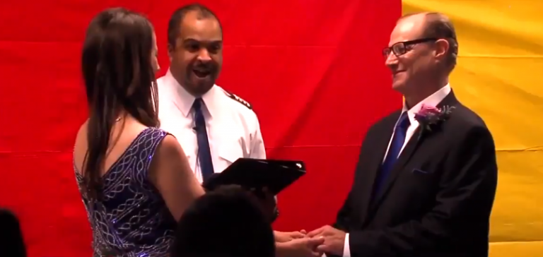 Couple get married at airport baggage claim