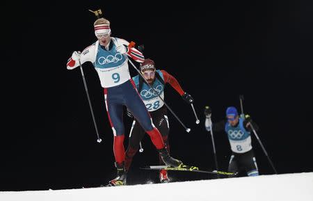 Biathlon - Pyeongchang 2018 Winter Olympics - Men's 20 km Individual Final - Alpensia Biathlon Centre - Pyeongchang, South Korea - February 15, 2018 - Johannes Thingnes Boe of Norway, Benjamin Weger of Switzerland and Kalev Ermits of Estonia compete. REUTERS/Murad Sezer