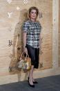 <p>Catherine looked sophisticated in a tweed top, carrying one of the bags from the collection.<br><i>[Photo: Reuters]</i> </p>