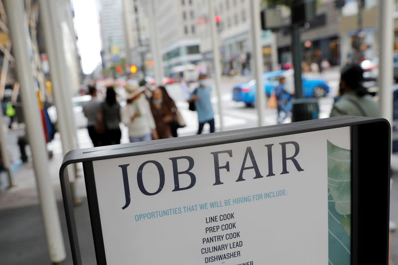 Signage for a job fair is seen on 5th Avenue after the release of the jobs report in Manhattan, New York City