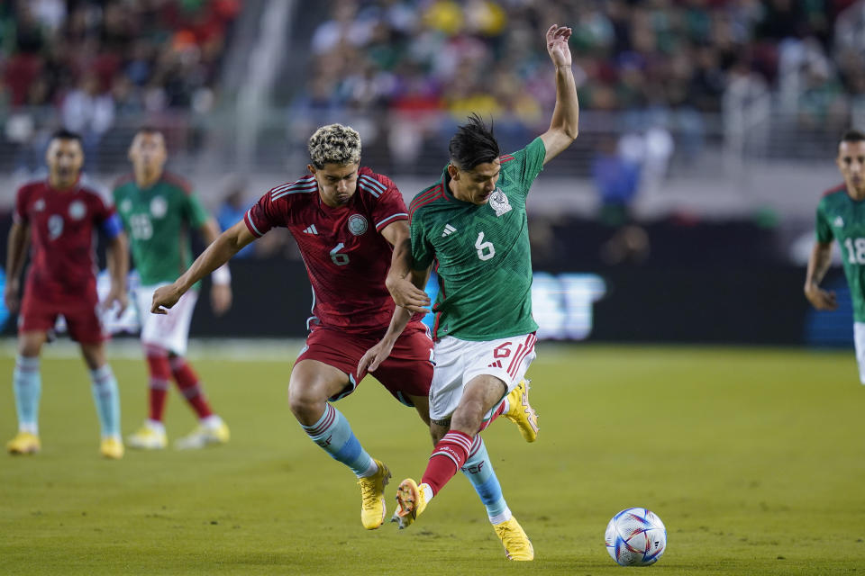 Mexico defender Jorge Sanchez (6) dribbles the ball while being defended by Colombia midfielder Steven Alzate (6) during the first half of an international friendly soccer match in Santa Clara, Calif., Tuesday, Sept. 27, 2022. (AP Photo/Godofredo A. Vásquez)