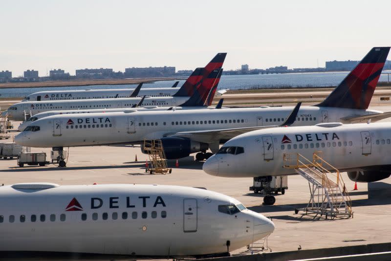 FILE PHOTO: Delta planes are seen at the platform after the Federal Aviation Administration (FAA) temporarily halted flights arriving at New York City airports due to coronavirus disease (COVID-19) in New York
