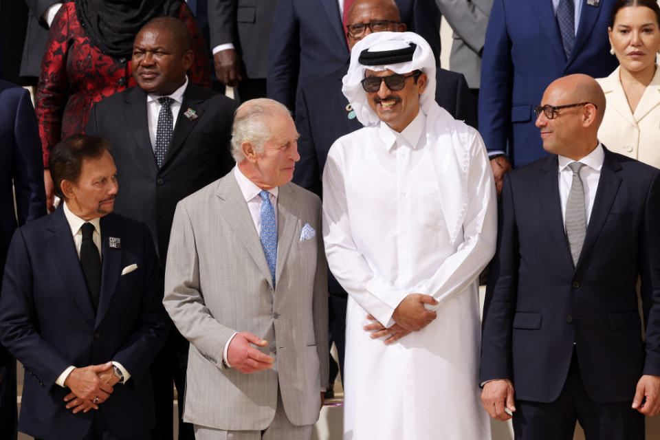 DUBAI, UNITED ARAB EMIRATES - DECEMBER 01: (L-R) Brunei Sultan Hassanal Bolkiah, King Charles III, Qatari Emir Sheikh Tamim bin Hamad Al Thani and Simon Stiell, Executive Secretary of the United Nations Framework Convention on Climate Change, speak as they prepare for a family photo during day one of the high-level segment of the UNFCCC COP28 Climate Conference at Expo City Dubai on December 01, 2023 in Dubai, United Arab Emirates. The COP28, which is running from November 30 through December 12, brings together stakeholders, including international heads of state and other leaders, scientists, environmentalists, indigenous peoples representatives, activists and others to discuss and agree on the implementation of global measures towards mitigating the effects of climate change. (Photo by Sean Gallup/Getty Images)