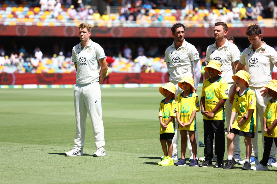 Cameron Green stands for the national anthem.