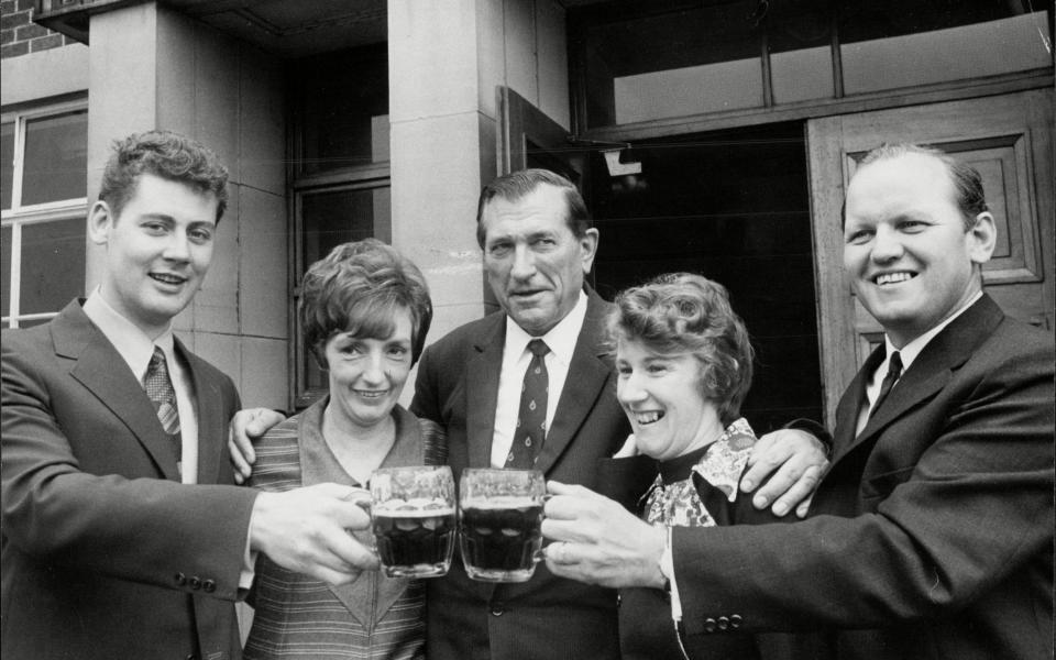 Walker, right, with his wife Kathleen, and colleagues Ian Hampson, left - he was also shot during the jewellery robbery - his wife, and chief constable Bill Palfrey, a month after the raid - ANL/Shutterstock