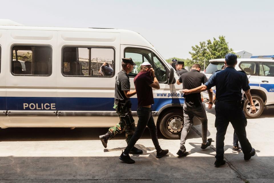 Israeli tourists, suspected of raping a 19-year-old British girl in Ayia Napa, leave the court premises in the eastern Cypriot resort of Paralimni on July 26, 2019. - A group of young Israeli tourists appeared again before a Cyprus court after the alleged gang rape of a British teenager in a popular resort. The group of 12 Israelis has not yet been charged, police sources said, later adding that five of them were released on Thursday. (Photo by Iakovos Hatzistavrou / AFP)        (Photo credit should read IAKOVOS HATZISTAVROU/AFP/Getty Images)