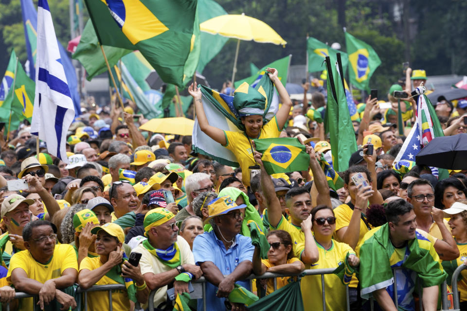 Followers of former Brazilian President Jair Bolsonaro rally to express their support for him in Sao Paulo., Brazil, Sunday, Feb. 25, 2024. Bolsonaro and some of his former top aides are under investigation into allegations they plotted a coup to remove his successor, Luis Inacio Lula da Silva. (AP Photo/Andre Penner)