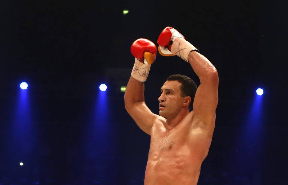 IBF, WBA, WBO and IBO champion Wladimir Klitschko from Ukraine celebrates knocking out his Australian challenger Alex Leapai during their heavyweight world title bout in Oberhausen, western Germany, Saturday, April 26, 2014. (AP Photo/Frank Augstein)