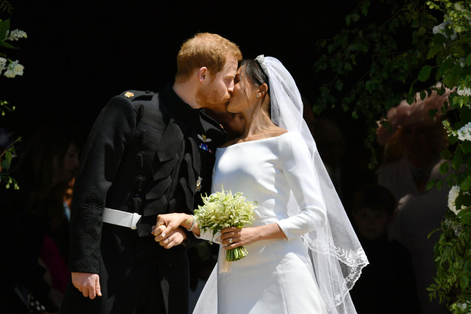 <p>The couple were wed at St George’s Chapel in Windsor on May 19, 2018 and their big day was watched by millions around the world. Cheers erupted when the couple shared their first kiss as husband and wife on the steps (PA) </p>