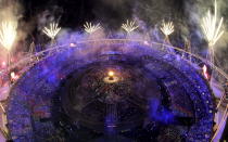 Fireworks light up over the stadium during the Opening Ceremony at the 2012 Summer Olympics, Saturday, July 28, 2012, in London. (AP Photo/David J. Phillip)