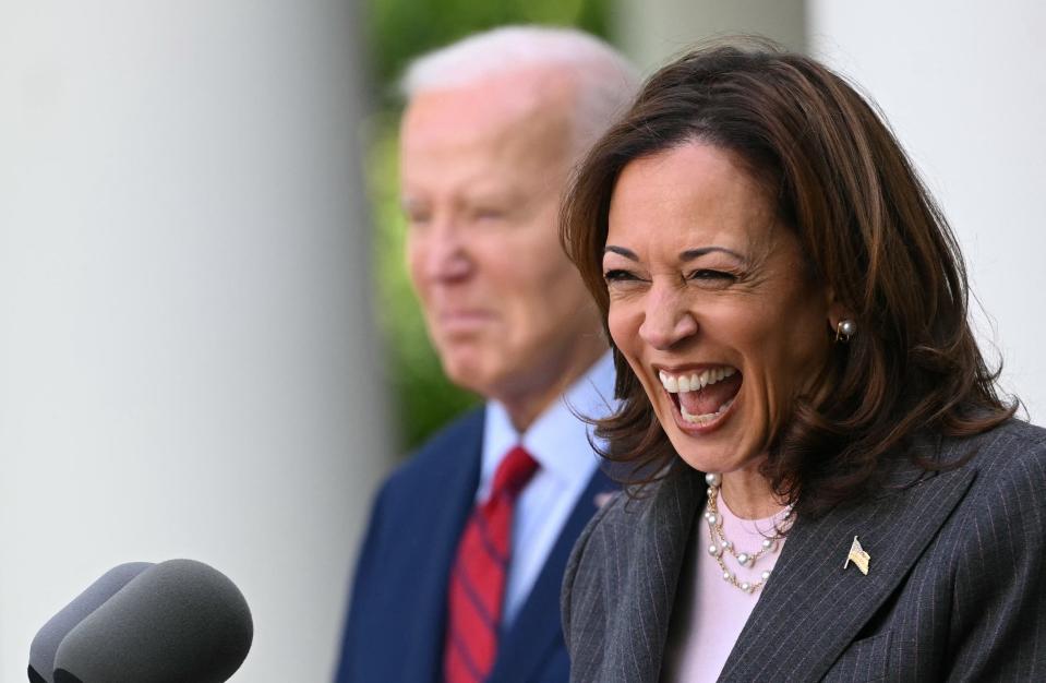 President Joe Biden listens as Vice President Kamala Harris delivers remarks at a reception celebrating Asian American, Native Hawaiian, and Pacific Islander Heritage Month in the Rose Garden of the White House in Washington, DC on May 13, 2024.