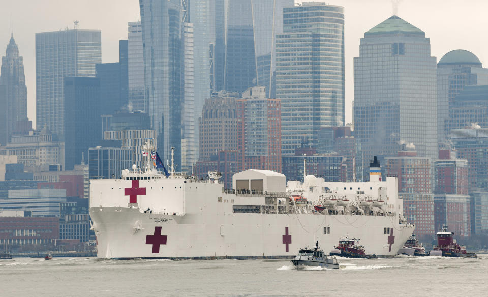 NEW YORK, NY - MARCH 30:  The USNS Comfort hospital ship travels up the Hudson River as it heads to Pier 90 on March 30, 2020 in New York City. The Comfort, a floating hospital in the form of a Navy ship, is equipped to take in patients within 24 hours but will not be treating people with COVID-19. The ship's 1,000 beds and 12 operation rooms will help ease the pressure on New York hospitals, many of which are now overwhelmed with COVID-19 patients.  (Photo by James Devaney/Getty Images)