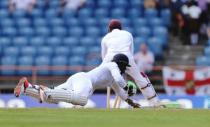 Cricket - West Indies v England - Second Test - National Cricket Ground, Grenada - 24/4/15 England's Chris Jordan is run out by Denesh Ramdin Action Images via Reuters / Jason O'Brien