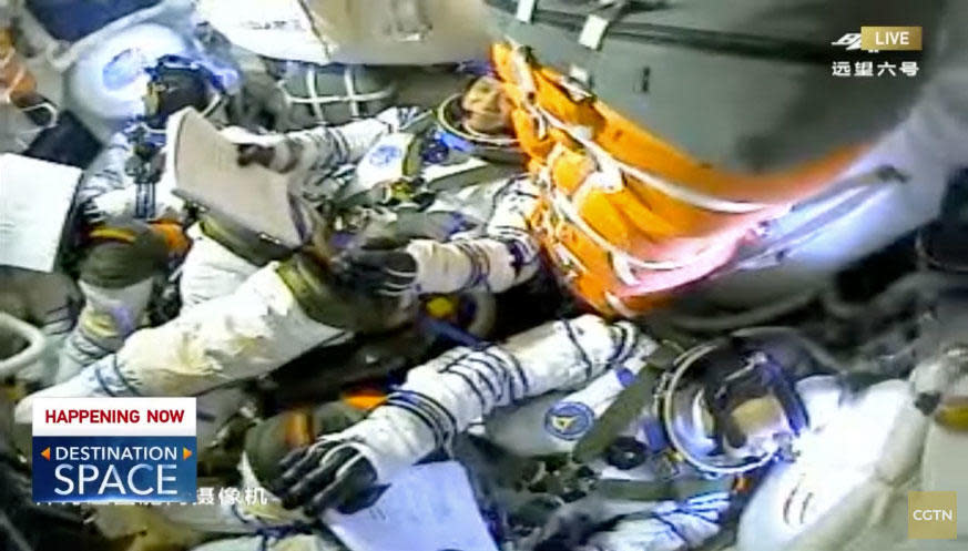 The Chinese astronauts relax after reaching orbit. Left to right: Tang Hongbo, mission commander Nie Haisheng and Liu Boming. / Credit: CGTN webcast