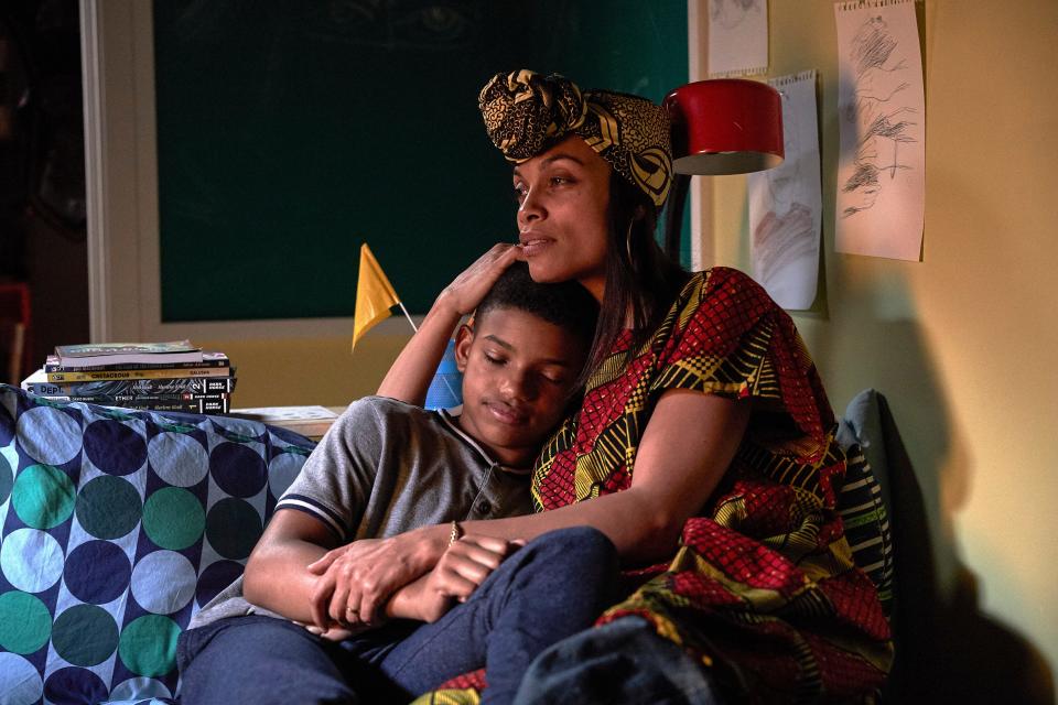 Mary (Rosario Dawson) embraces her caring son Gunner (Lonnie Chavis) in the family adventure "The Water Man."
