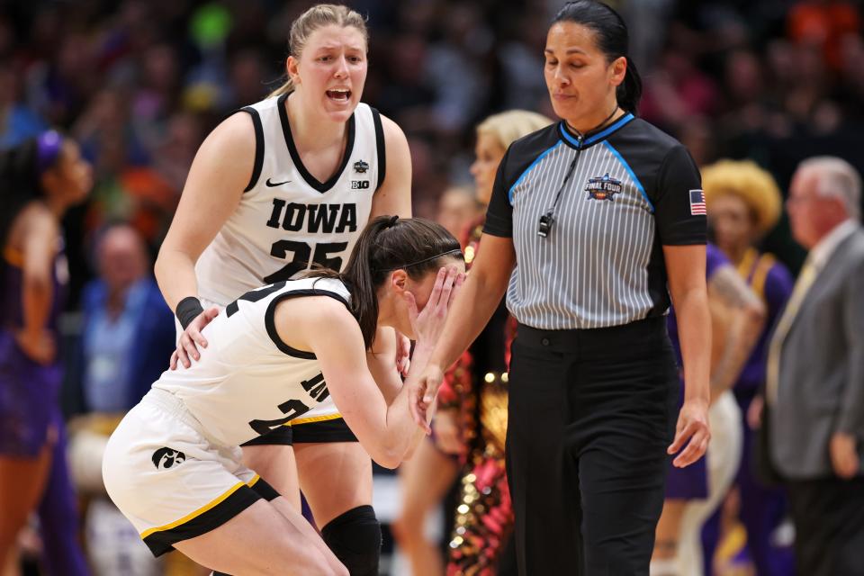 Caitlin Clark cringes after picking up a technical foul late in the third quarter just moments after teammate Monika Czinano was whistled for her fourth foul.