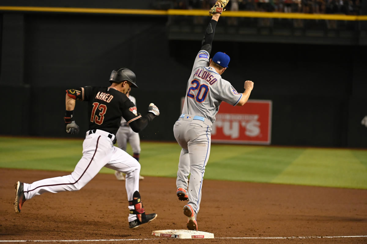 New York Mets' Mark Canha walks through the dugout prior to a