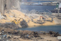 Rescue teams search for missing people at the site of the Aug. 4 explosion that killed more than 170 people, injured thousands and caused widespread destruction, in Beirut, Lebanon, Friday, Aug. 14, 2020. (AP Photo/Hassan Ammar)