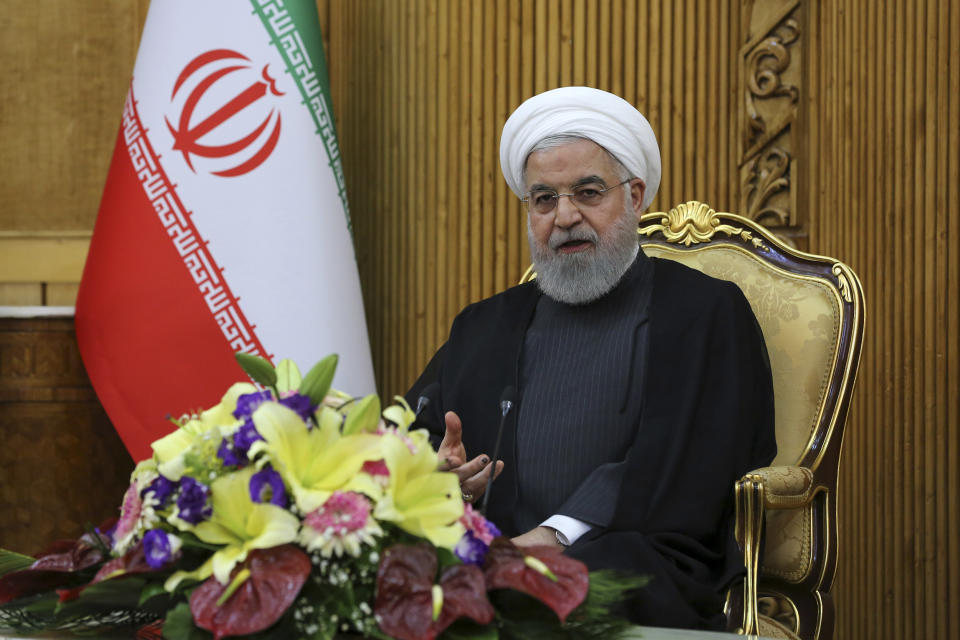 In this photo released by the official website of the office of the Iranian Presidency, President Hassan Rouhani briefs media at Mehrabad airport pavilion upon arriving in Tehran from New York, where he attended the United Nations General Assembly, Iran, Friday, Sept. 27, 2019. Rouhani said U.S. sanctions on his country are "more unstable than ever." (Iranian Presidency Office via AP)