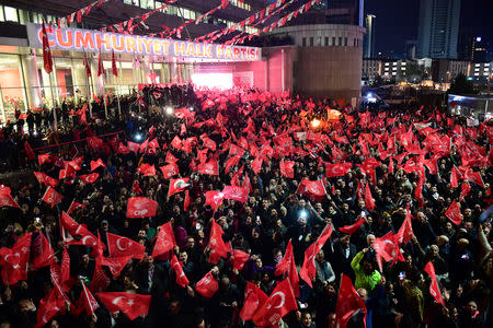 Supporters of the main opposition Republican People's Party (CHP) gather in front of the party's headquarters to celebrate the municipal elections results in Ankara, Turkey, March 31, 2019. REUTERS/Stringer
