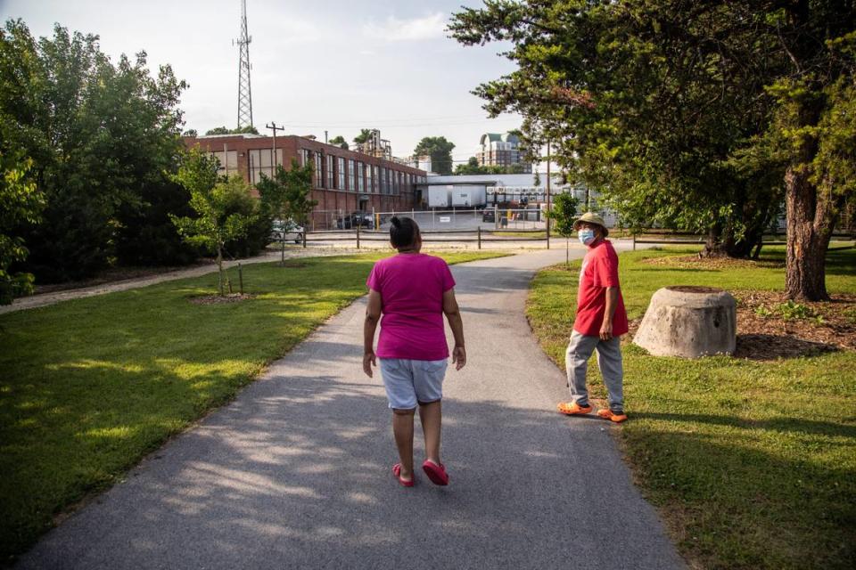 Johnny and Denise Horne walk along a greenway where a sharp burning plastic smell fills the air around an Innospec chemical factory in High Point.