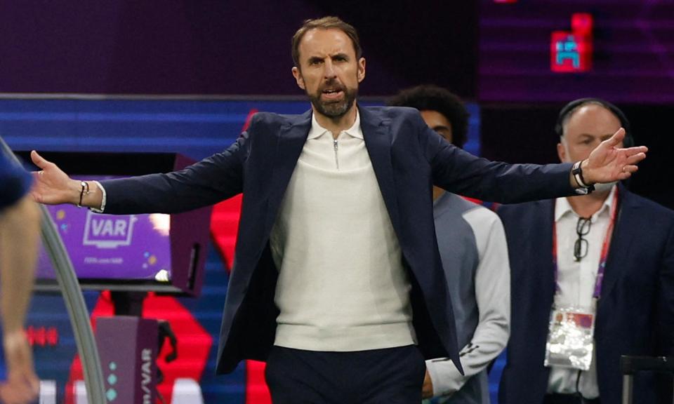 <span>England manager Gareth Southgate in his quarter-zip knitted polo at the World Cup in Qatar in 2022.</span><span>Photograph: John Sibley/Reuters</span>