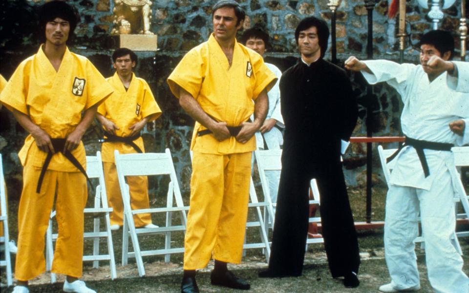 John Saxon, centre, alongside Bruce Lee in Enter the Dragon - Moviestore/Shutterstock