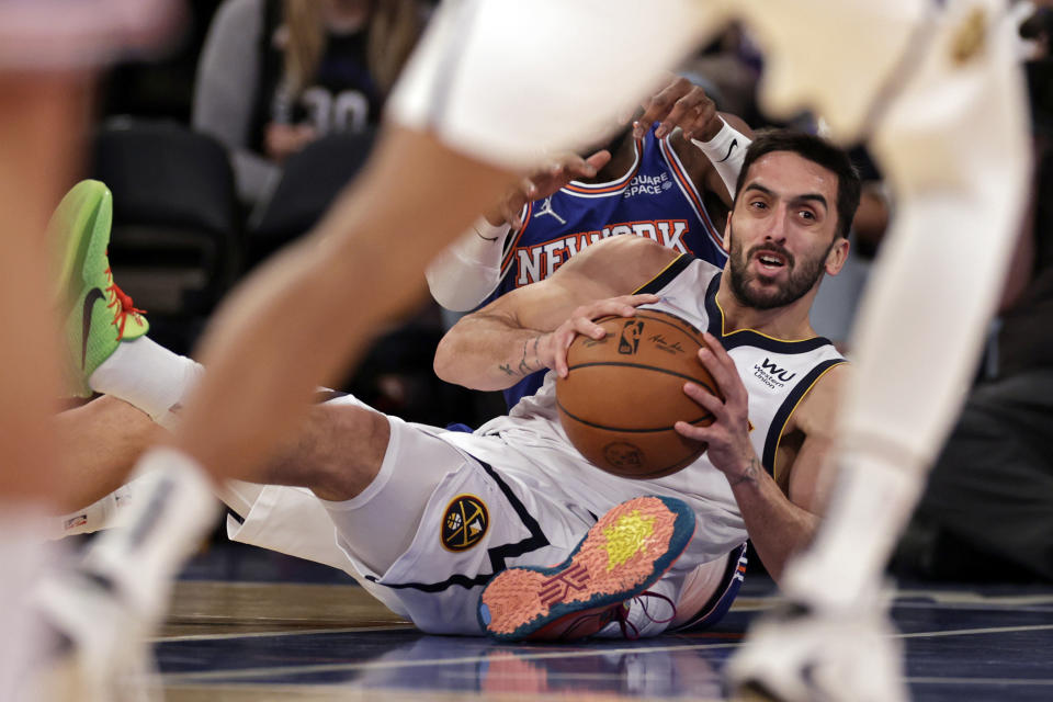 Denver Nuggets guard Facundo Campazzo looks to pass against the New York Knicks during the first half of an NBA basketball game Saturday, Dec. 4, 2021, in New York. (AP Photo/Adam Hunger)