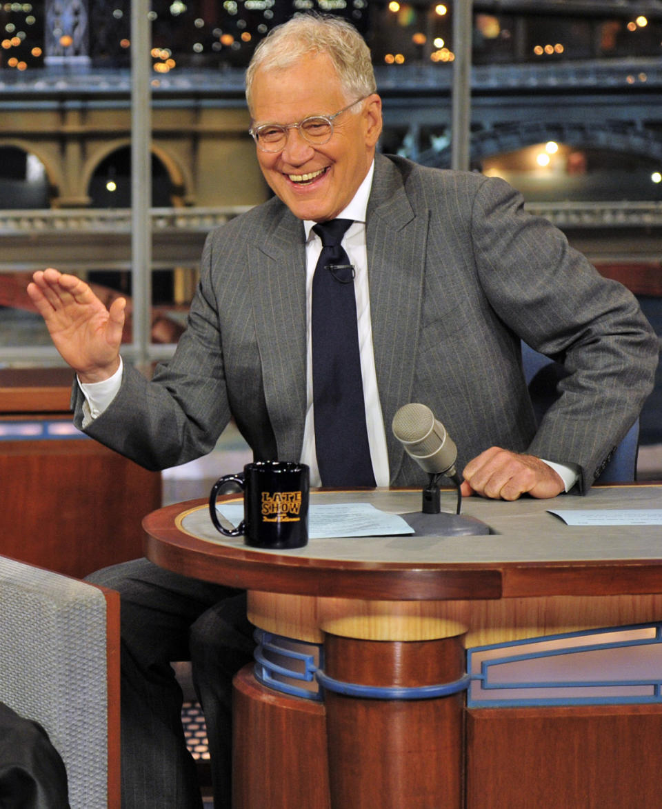 FILE - In this June 21, 2012 file photo provided by CBS, host David Letterman appears at a taping of his shows"Late Show with David Letterman" in New York. During a taping of his show Thursday, April 3, 2014, Letterman said he has informed his CBS bosses that he will step down in 2015, when his current contract expires. He told his audience he expects his departure will be “at least a year or so” from now. (AP Photo/CBS Broadcasting Inc., John Paul Filo, File) MANDATORY CREDIT