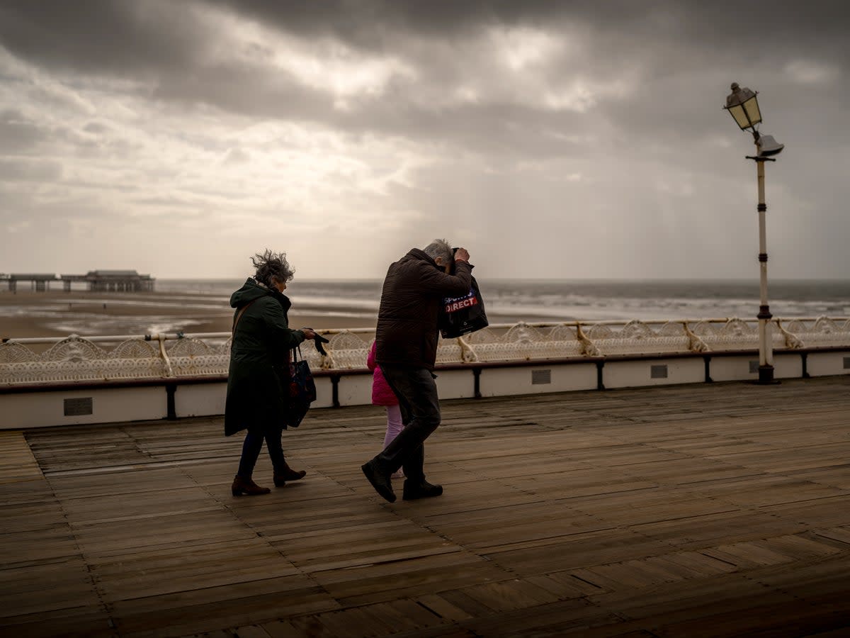 People brave the wind and rain on Blackpool’s North Pier during Storm Kathleen  (Getty Images)