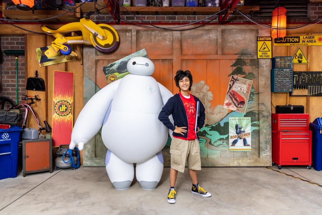 When guests step into San Fransokyo Square at Disney California Adventure Park in Anaheim, Calif., they may have the opportunity to interact with boy genius Hiro Hamada and his huggable healthcare companion robot, Baymax, outside the Hamada Bot Shop. This converted warehouse is where the Big Hero 6 team builds their hi-tech gear.