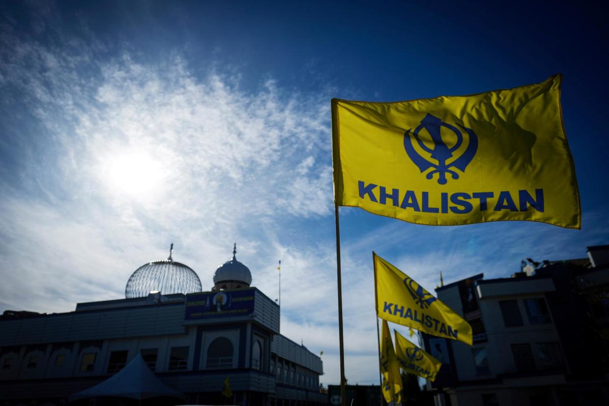 <span>Khalistan flags in Surrey, British Columbia. Sikh separatists advocate for the establishment of the independent Sikh state.</span><span>Photograph: Darryl Dyck/AP</span>